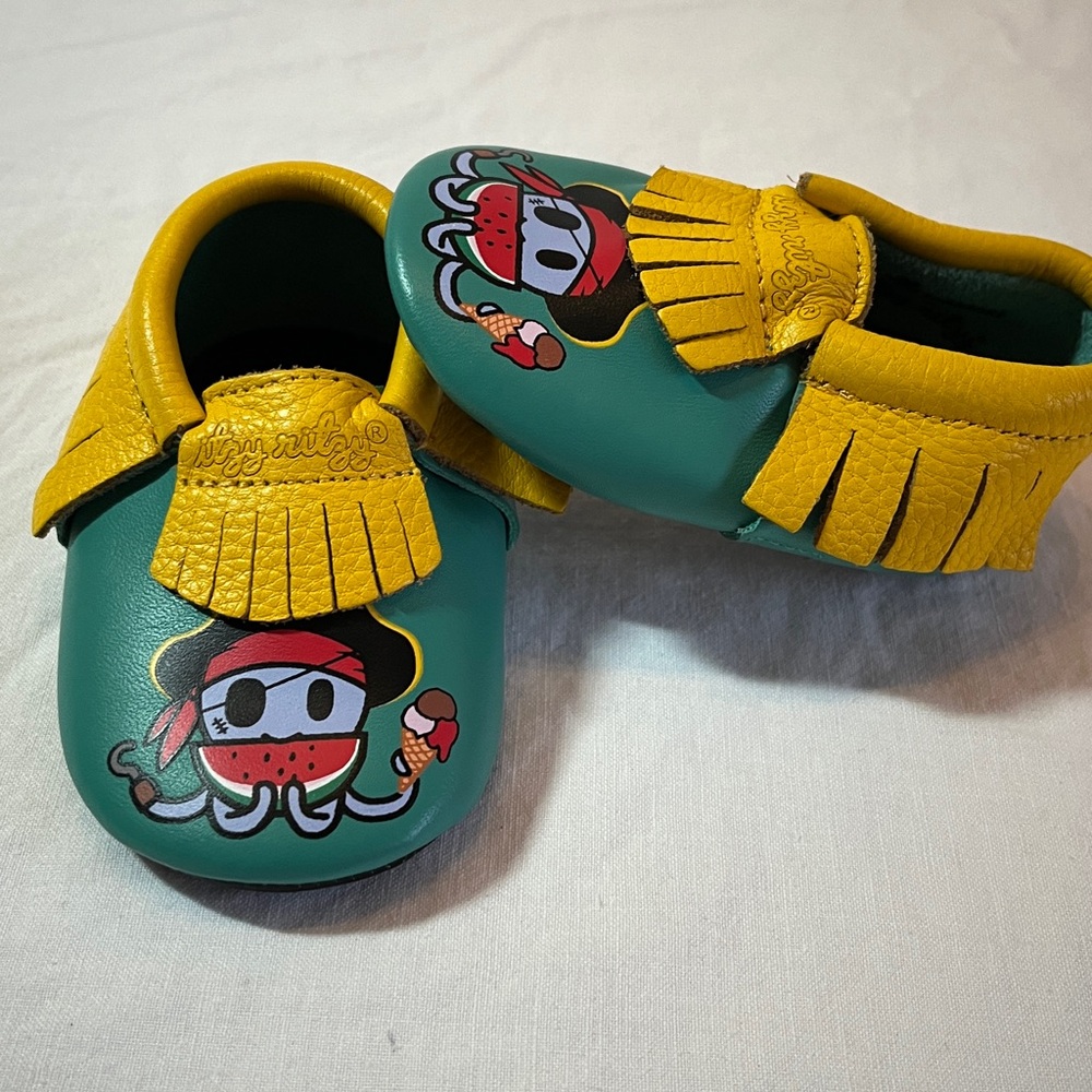 NWOT 0-6M Itzy Ritzy Tokidoki Kids Moccasins - Green and Yellow Pirate Design